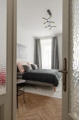 a bedroom with a bed and a window at Meloun City Center Residence in Prague