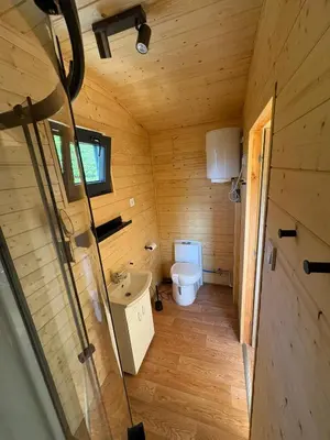 a small bathroom with a toilet and a sink at Sádky Lety in Lety