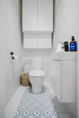 a white bathroom with a toilet and a sink at Prague Days - Boho One-bedroom Apartment with Netflix in Vinohrady in Prague