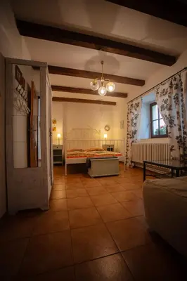 a large room with a bed in a room at Statek Adámek in Borotice