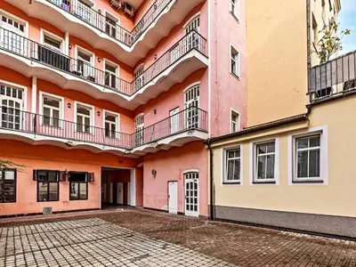 an apartment building with balconies and a courtyard at Cosy Studio in Vysehrad in Prague