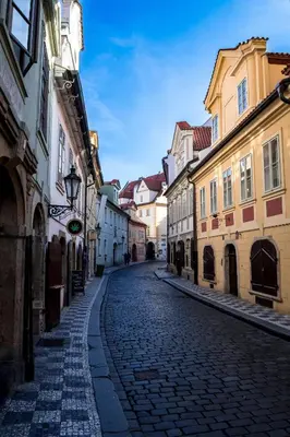 a cobblestone street in a city with buildings at Pokoj A2 v Praze in Prague