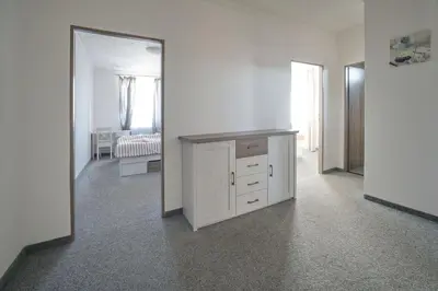 a white room with a vanity and a mirror at Penzion a restaurace U Jágrů in Kladno