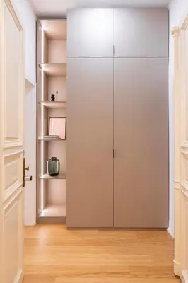 a closet in a room with white walls and wooden floors at TurnKey I Vinohrady Modern Apartments in Prague