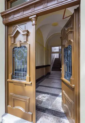 an entrance to a building with stained glass windows at TurnKey I Vinohrady Modern Apartments in Prague