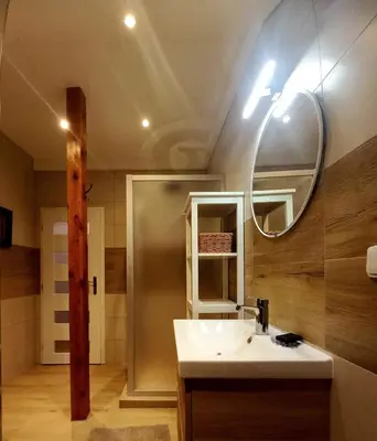 a bathroom with a sink and a mirror at Apartment Dreamy Valley in Nenačovice
