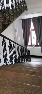 a stair case with a railing and a window at Nový pokoj u Pražského výstaviště A3 in Prague
