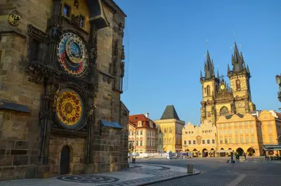 a building with a clock on the side of it at Nový pokoj u Pražského výstaviště A3 in Prague