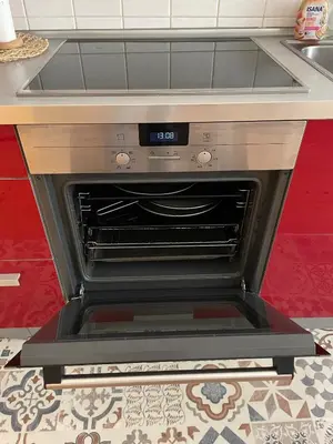 an oven with the door open in a kitchen at Apartment Flora Lobkovic in Prague