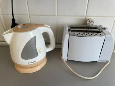 a tea kettle and a toaster on a counter at Apartment Flora Lobkovic in Prague