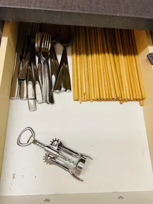 a trumpet sitting on top of a counter with utensils at Chodov apartmán in Prague