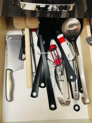a drawer filled with lots of different kitchen utensils at Chodov apartmán in Prague