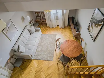 an overhead view of a living room with a couch and a table at Under the Bells of Týn Church in Prague