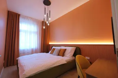 a bedroom with a bed with white sheets and pillows at Luxemi Apartments I Wenceslas Square in Prague