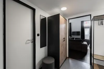 a hallway with a door leading to a living room at Family duplex apartment near center in Prague
