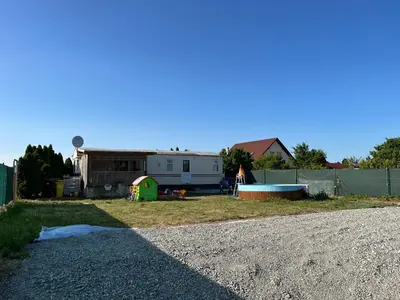 an rv parked on the side of a gravel road at Mobilheim Natálka in Račice