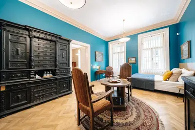 a bedroom with a large dresser and a bed at WagnerStays Grand Nest 6BD Billiard&Sauna&Cinema in Prague