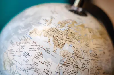 a close up of a world globe with a toothbrush at WagnerStays Grand Nest 6BD Billiard&Sauna&Cinema in Prague