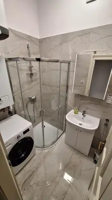 a bathroom with a shower and a toilet and a sink at City center apartment Thomas No3 in Prague