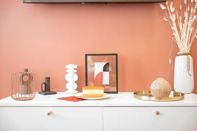 a shelf with a plate of cake and other items on it at Cozy nest - Perfect for Two in Prague