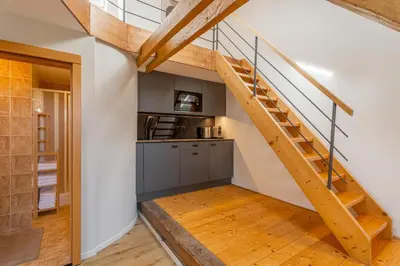 a kitchen and staircase in a loft conversion at Parkview Studio in Prague