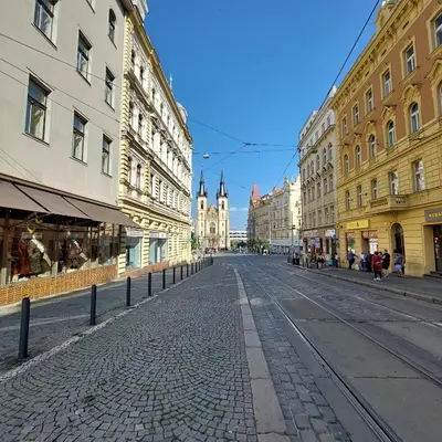 an empty street in a city with buildings at Zlatý pokoj v centru Prahy B1 in Prague