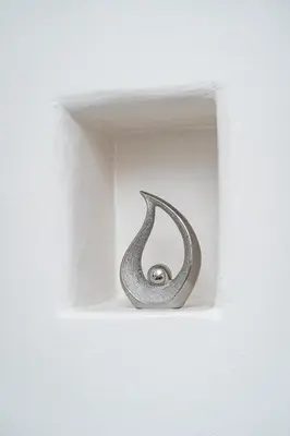 a metal door knob in a white wall at Victory Castle Suite in Prague