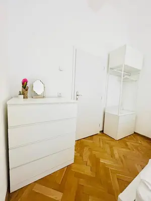 a room with a white dresser and a mirror at New apartment near Wenceslas Square in Prague