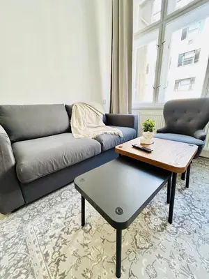 a living room with a couch and a coffee table at New apartment near Wenceslas Square in Prague