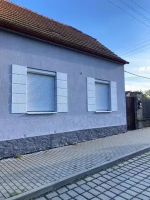 two windows on the side of a building at Domek Jiráskova in Dobříš