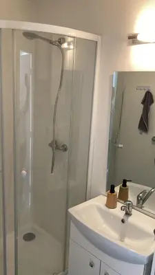 a bathroom with a shower and a sink at Domek Jiráskova in Dobříš