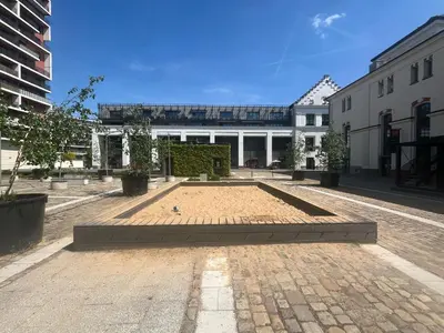 a courtyard with a building in the background at Old Brewery Terrace Apartment in Prague