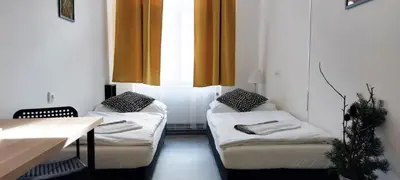 a room with two couches and a table and a window at B2 Dvoulůžkový pokoj centrum Prahy in Prague