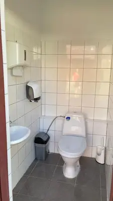 a bathroom with a toilet and a sink at Kemp v areálu pivovaru Malý Janek z Jinec in Příbram