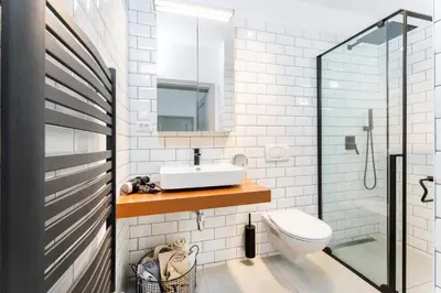 a bathroom with a sink and a toilet at Private house with garden in Nový Jáchymov