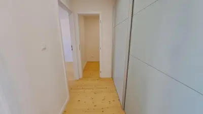 an empty hallway with a mirror in a room at Prague Urban Oasis Loft in Prague