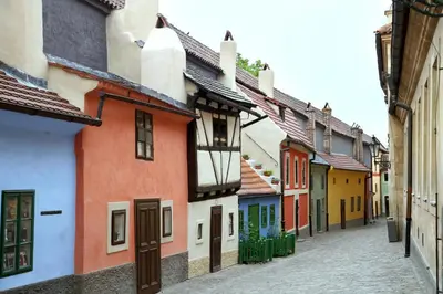 an alley with colorful houses on a street at Soukromý pokoj v centru C2 in Prague