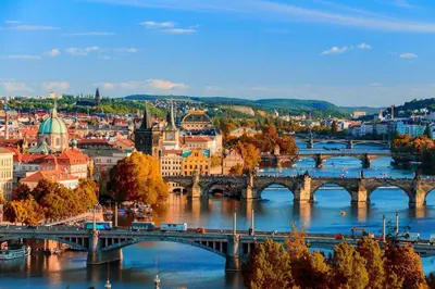 a view of a city with a bridge over the river at Cute room D2 Prague 7 in Prague
