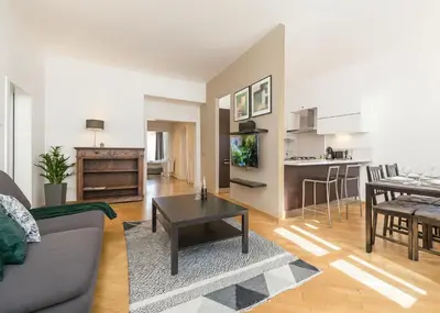 a living room with a couch and a table at FAMILY 2 BEDROOM APARTMENT IN THE CITY CENTRE - by WISHLIST PRAGUE in Prague
