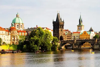 a city with a river and a bridge and buildings at Spacious room E1 in centre of Prague in Prague