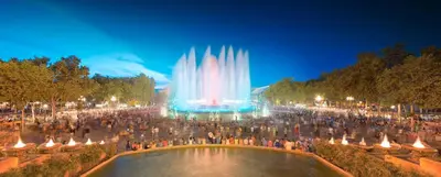 a crowd of people standing around a fountain at night at Nice room E3 Prague 7 in Prague