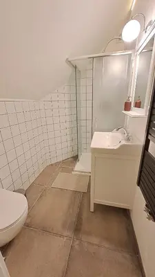 a bathroom with a toilet and a sink at Prague Panorama Loft in Prague