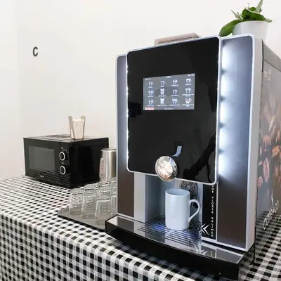 a black and silver coffee maker on a table at Prague room Letná H2 in Prague