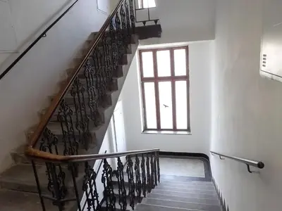 a staircase in a building with a window at Prague room Letná H2 in Prague