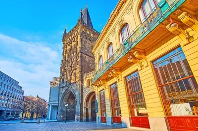 a large building with a tower in a city at Room for 3 number1 Prague 7 in Prague