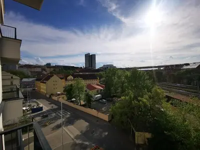 a view of a city from a balcony at free private Parking, central location, Nuslesky Pivovar sunset balcony home, in Prague