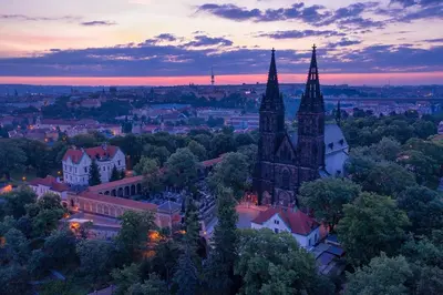 an aerial view of a city at sunset at free private Parking, central location, Nuslesky Pivovar sunset balcony home, in Prague