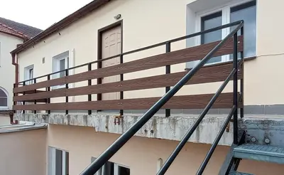 a wooden balcony on the side of a building at Apartmán Mělník 330 in Mělník