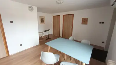a dining room with a blue table and chairs at Apartmán Mělník 330 in Mělník