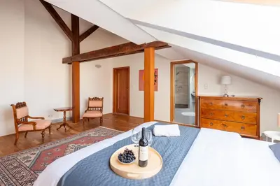a bedroom with a bed with a blue comforter at Apartment with terrace in Prague Center in Prague
